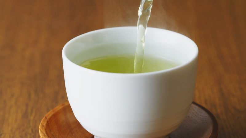 Sencha green tea being poured from a kyusu