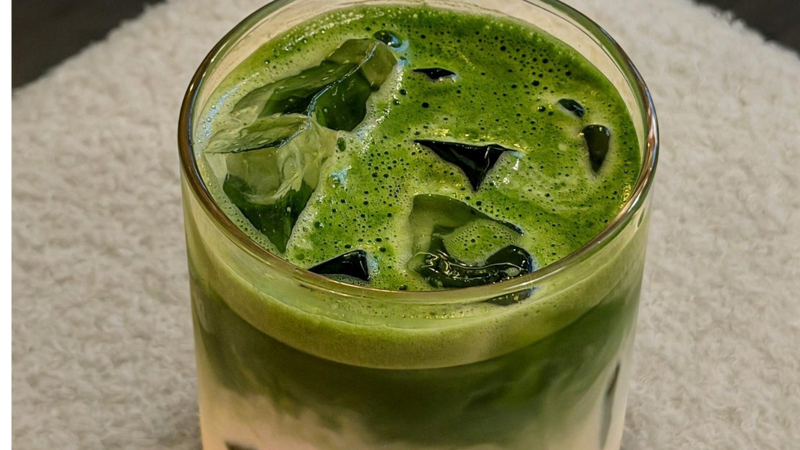 An iced matcha latte to go on a New York street
